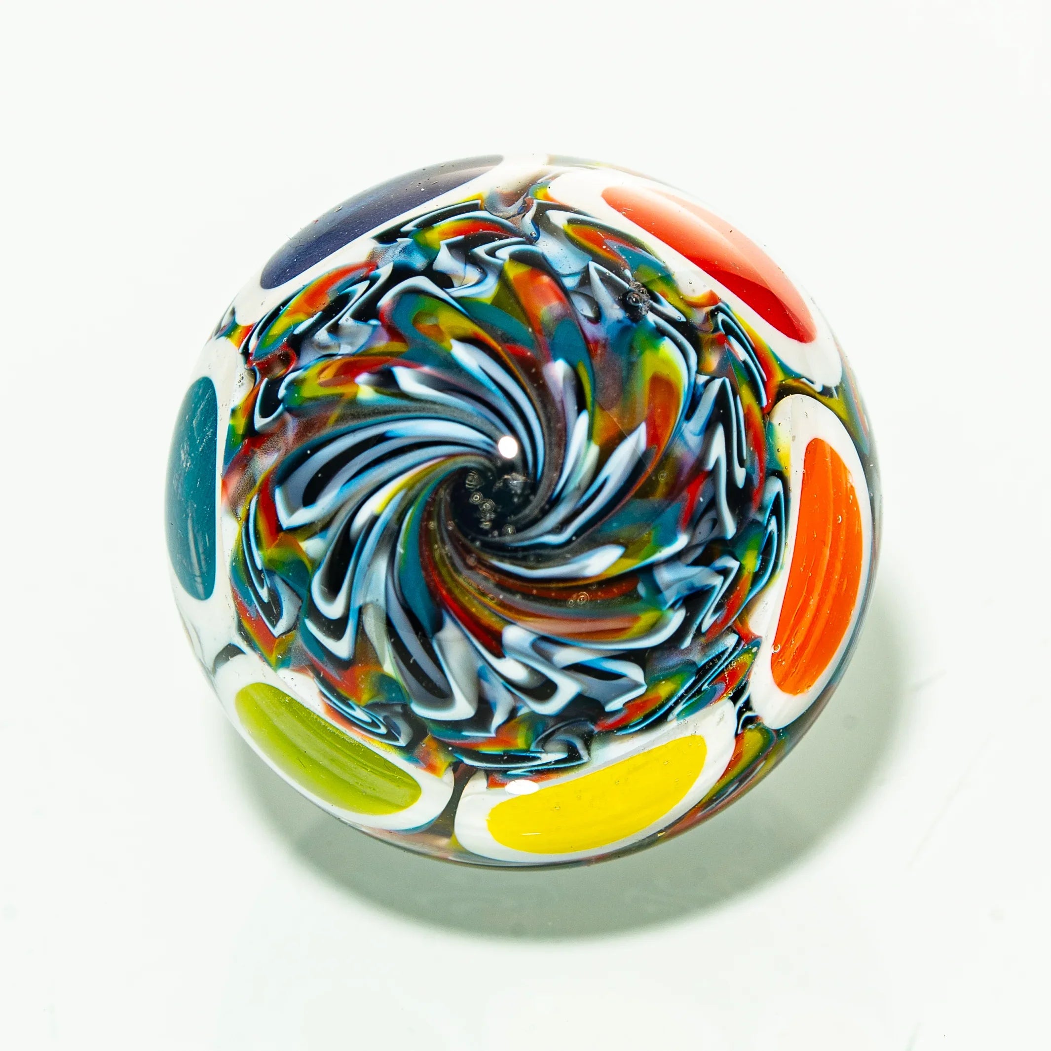 Colorful glass marble with swirl design and bold multicolor accents on white background