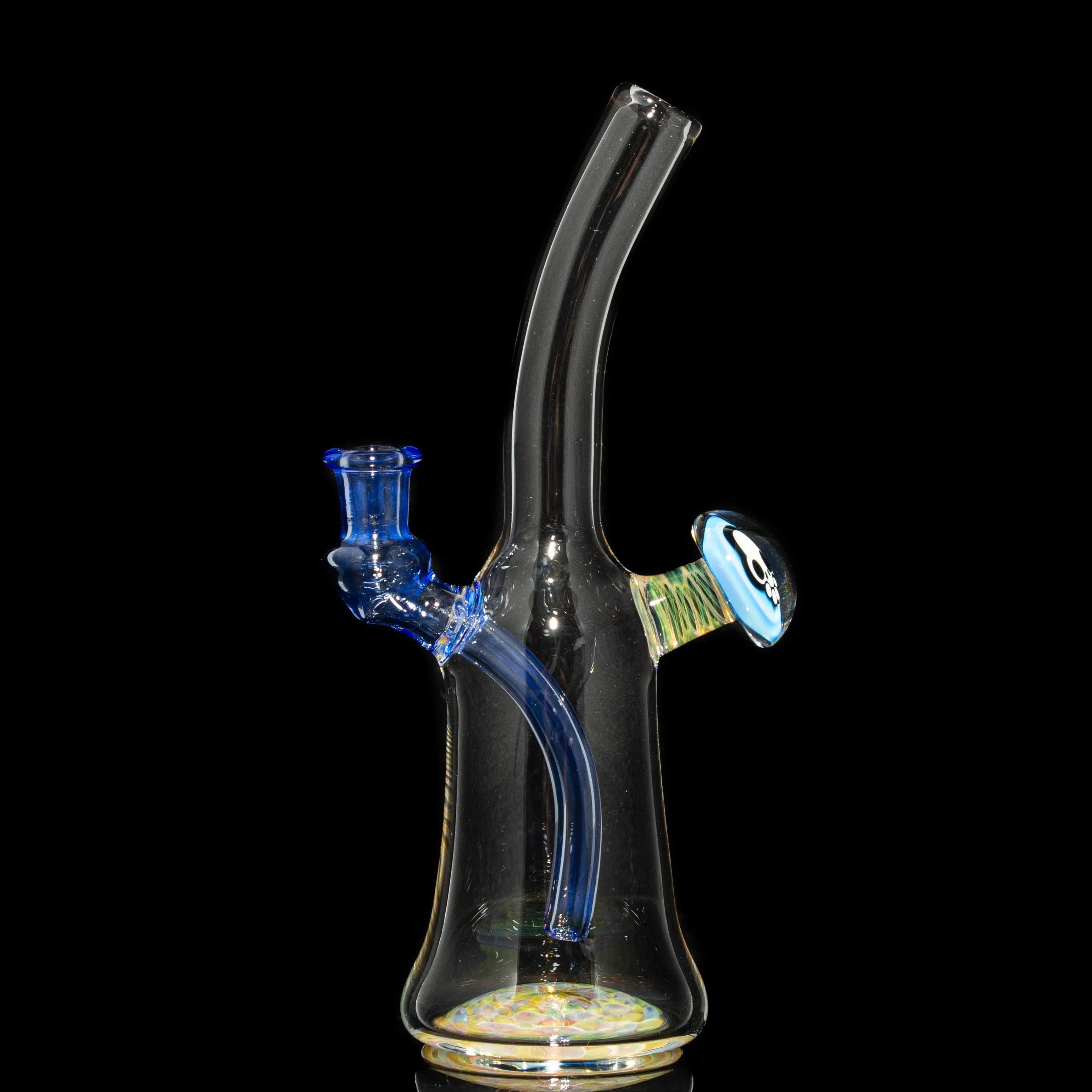 Heady glass water pipe with blue accents and decorative marble on a black background.