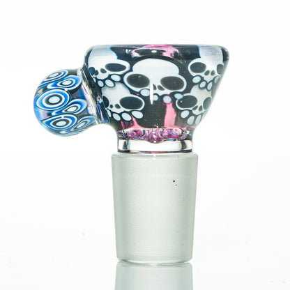 Artistic glass bowl piece with white skull designs and blue accents for water pipes