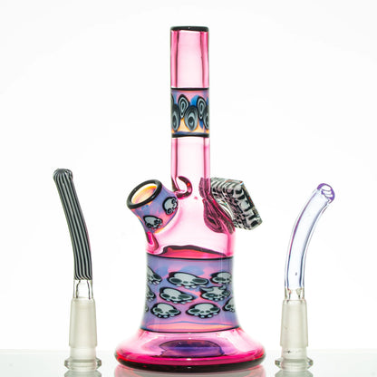 Colorful pink glass water pipe with skull designs and two alternative glass mouthpieces