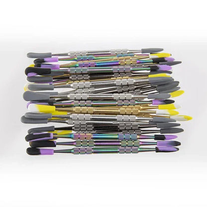 Assorted metal dabber tools with silicone sleeves in a stack, colorful ends visible