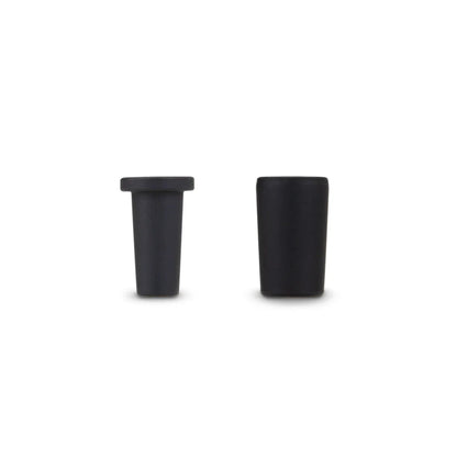 Two black silicone vaporizer accessory caps on a plain white background.