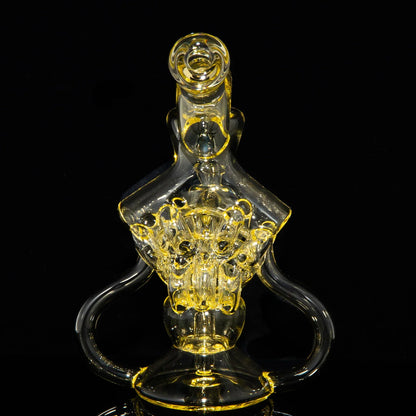 Intricate yellow glass water pipe with detailed percolator on black background