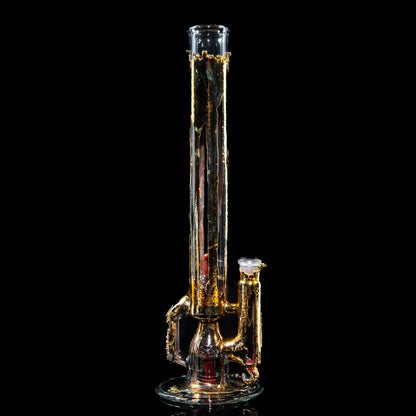 Gold-accented clear glass water pipe with intricate design on black background