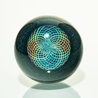 Heady glass marble with colorful spiral pattern and iridescent accents on white background