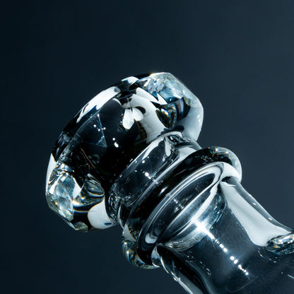 Close-up of artisan glass pipe mouthpiece with clear, thick glass and faceted detail