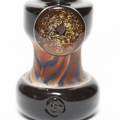 Handblown glass pipe with amber swirls and gold flecks, featuring a dark base and artistic design.