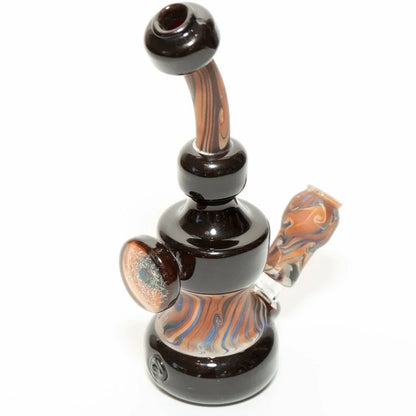 Handblown glass bubbler with amber swirls and dark base, featuring a curved neck and side carb hole.