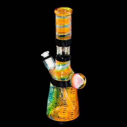 Colorful glass water pipe with triple pillar perc and intricate pattern on black background
