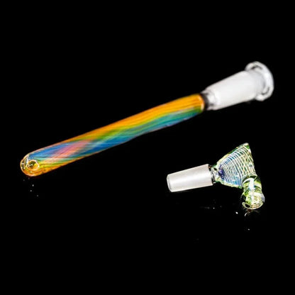 Colorful glass downstem and matching slide bowl for water pipe on black background