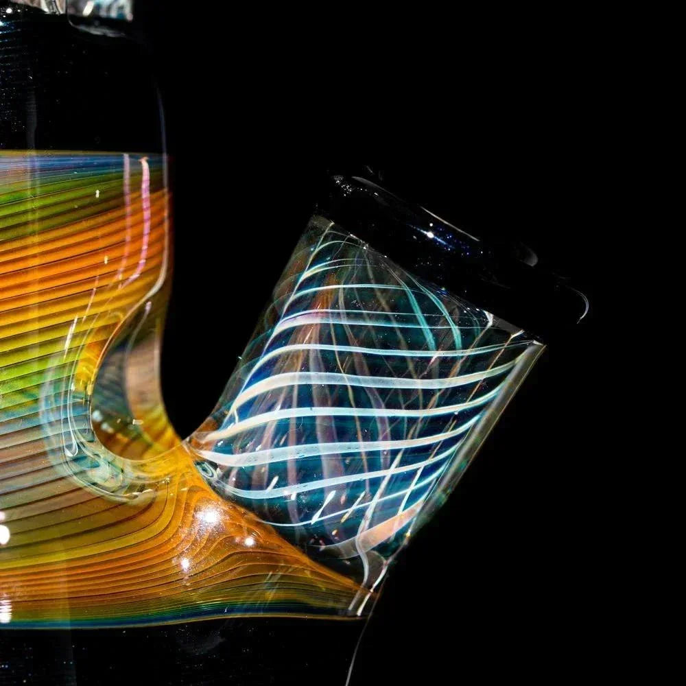 Close-up of colorful scientific glass water pipe with intricate swirl patterns