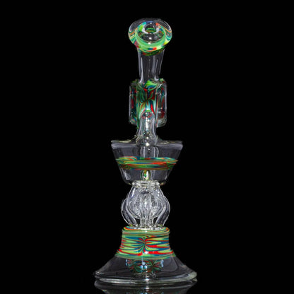 Heady glass water pipe with colorful swirling patterns on a black background