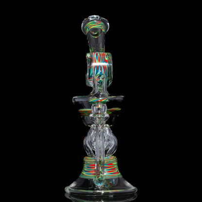 Heady glass water pipe with colorful linework accents on black background