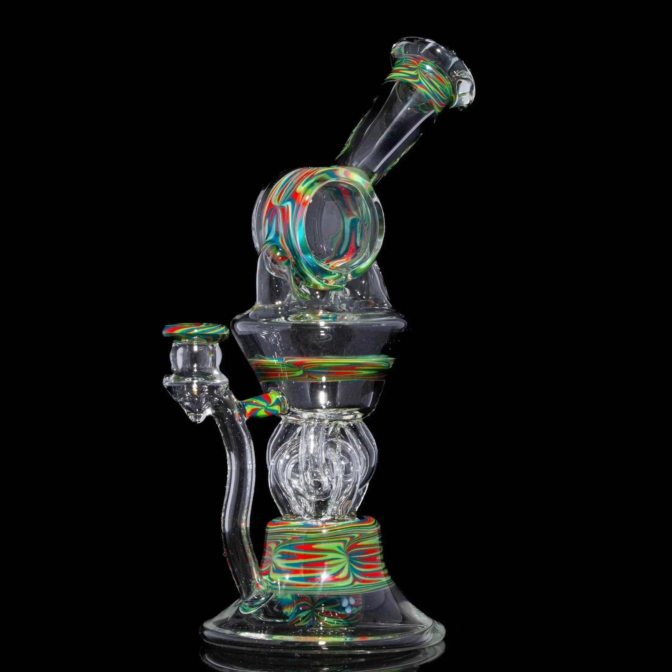 Heady glass water pipe with colorful swirl accents on a black background