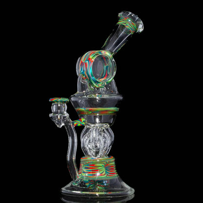 Heady glass water pipe with colorful swirl accents on a black background