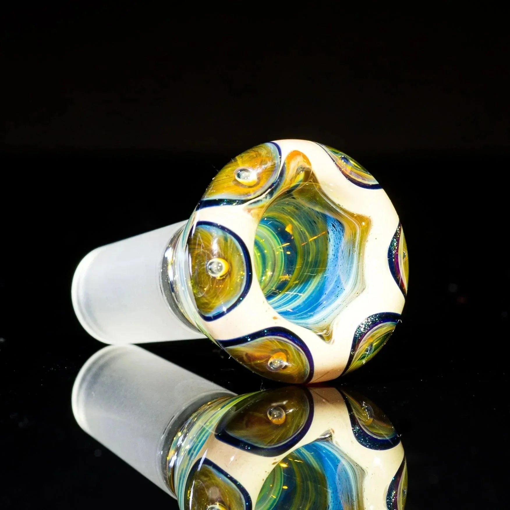 Colorful glass bowl slide with blue and gold swirls and 14mm frosted joint on black background.