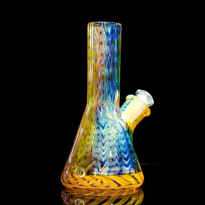 Colorful glass bong with rainbow swirls and chevron patterns, heady glass art piece