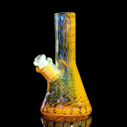 Vibrant yellow and blue heady glass bong with intricate swirls, showcased against black background