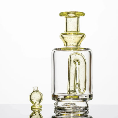 Clear glass bong with yellow accents and internal percolator, paired with matching bowl piece