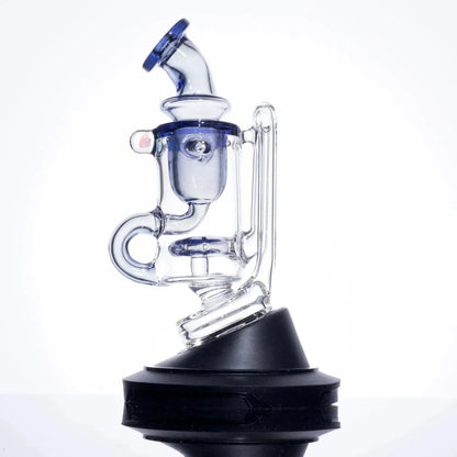 Clear glass dab rig with blue accents and black base, featuring percolator and angled mouthpiece