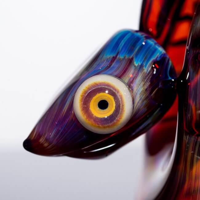 product shot of snake head and eye glass snake by Niko Cray in Amber Purple