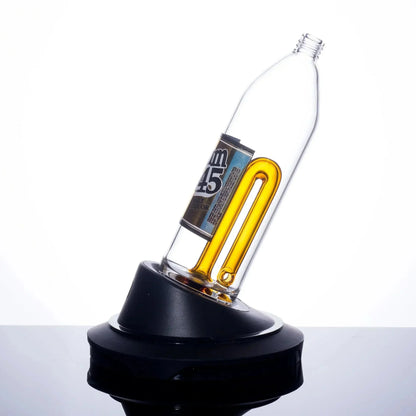 Clear glass bong with amber U-shaped tube and black base, showcasing heady glass design
