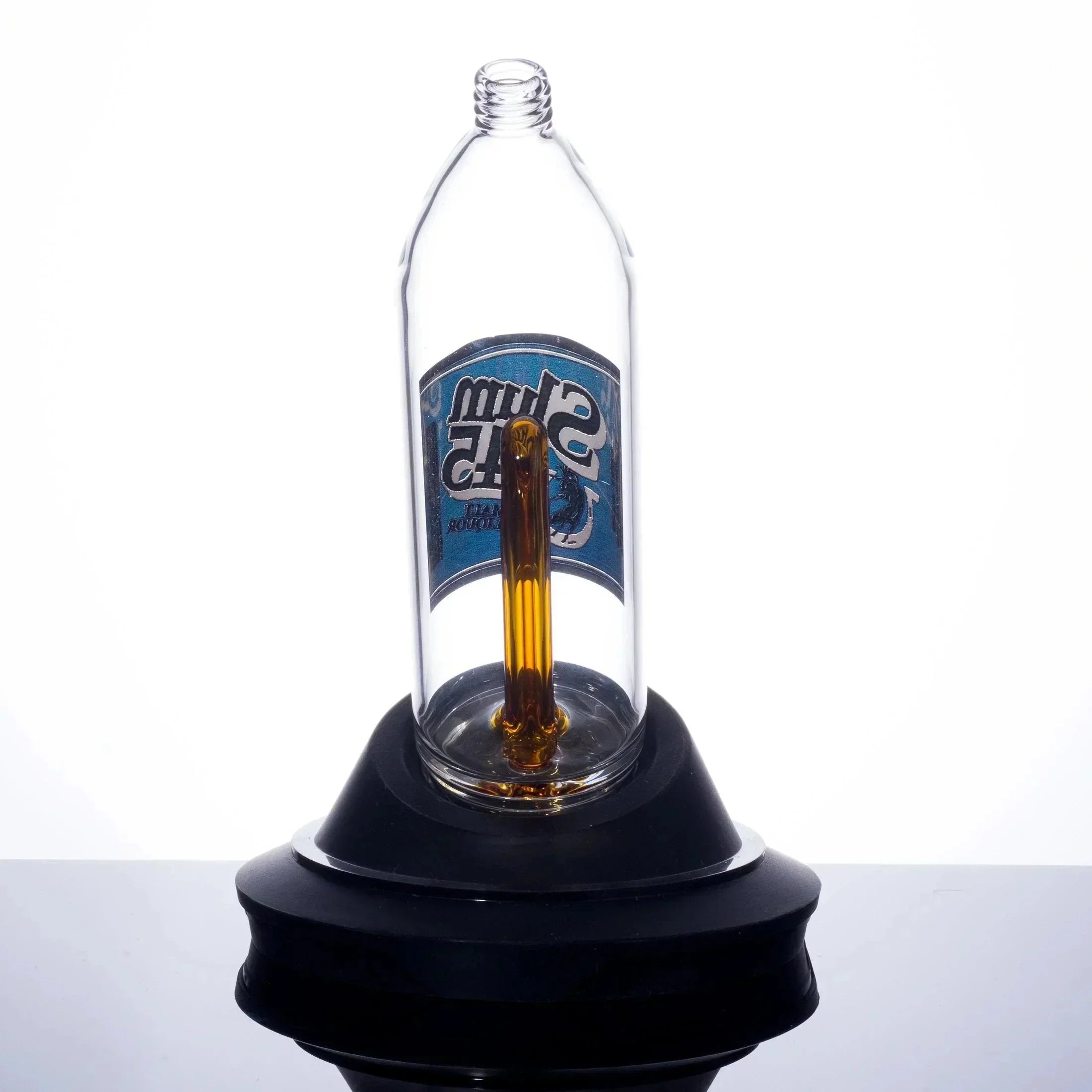 Clear glass bong with amber stem and blue label, displayed on black base