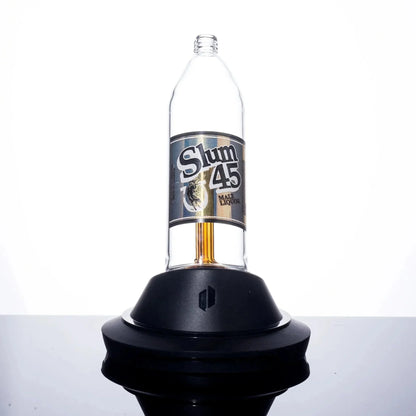 Slum 45 Malt Liquor bottle on black base, clear glass design with bold label