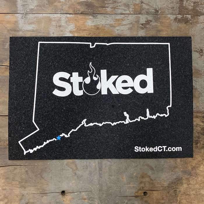 Stoked 12x18 inch mood mat, state of connecuticut outline with stoked logo centered. Stoked URL bottom right.