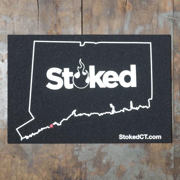 Stoked 12x18 inch mood mat, state of connecuticut outline with red location star and stoked logo centered. Stoked URL bottom right.
