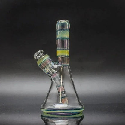 Colorful glass beaker water pipe with removable downstem and striped accents on black background